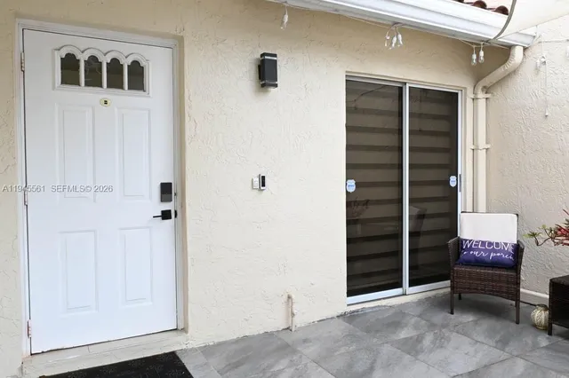 a view of room with windows and entryway