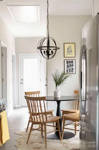 a bedroom with a bed a television and a window