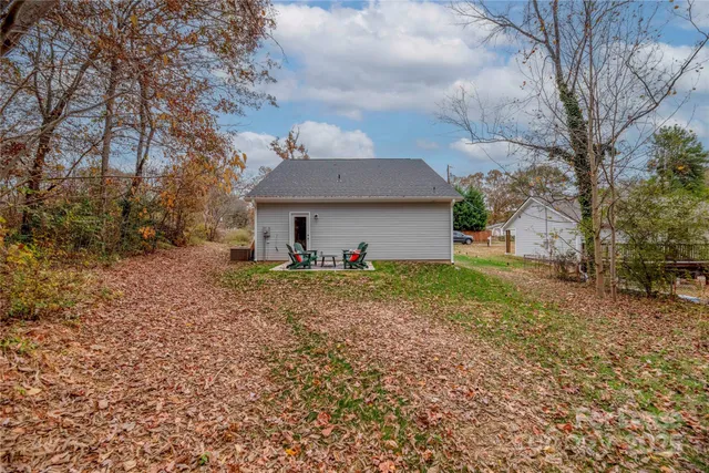 a living room with furniture and painting on the wall