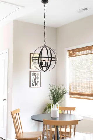 a bed room with a bed and a chair