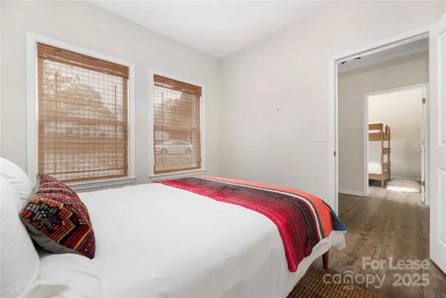 a bedroom with a bed and a chair