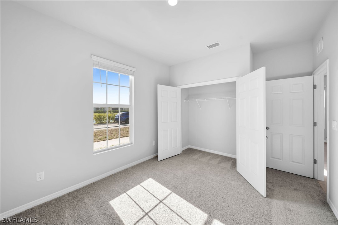 900 Friendship Circle LaBelle, FL 33935 - Photo 12 of 21 a view of an empty room with a window