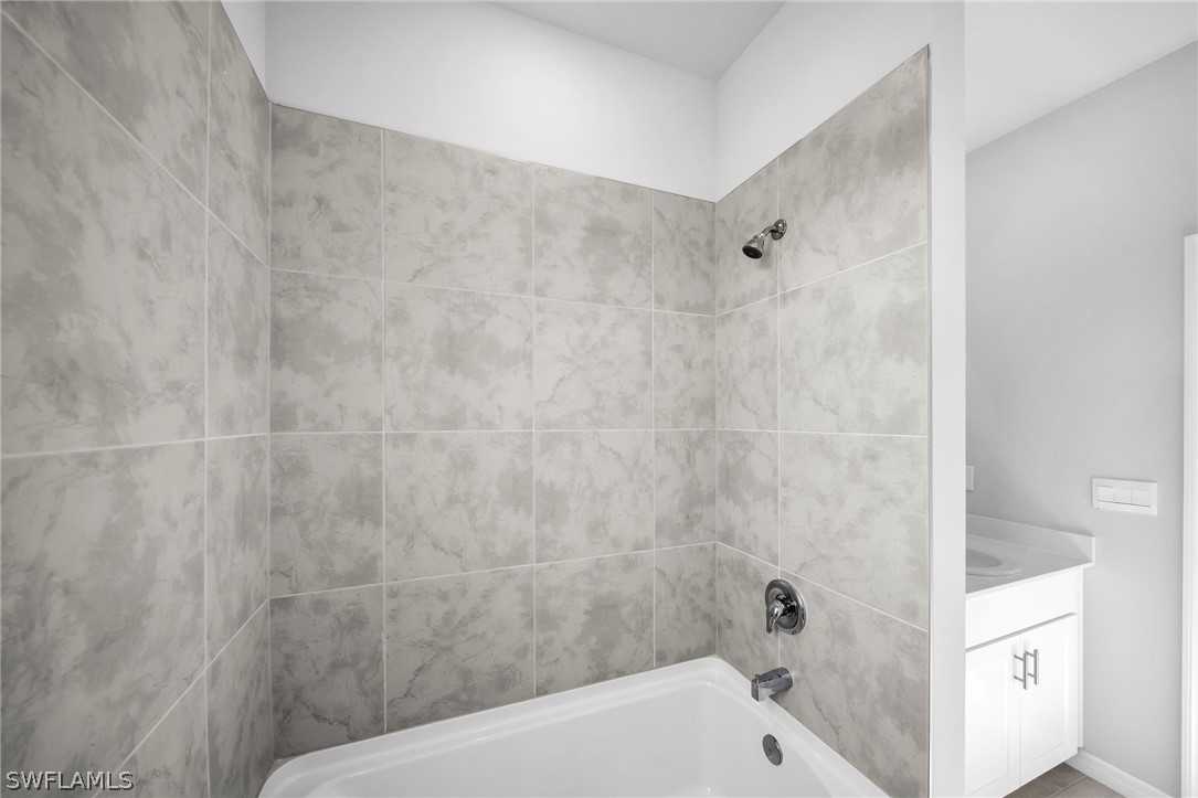 900 Friendship Circle LaBelle, FL 33935 - Photo 13 of 21 a bathroom with a bathtub and shower