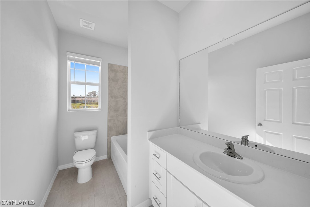 900 Friendship Circle LaBelle, FL 33935 - Photo 14 of 21 a bathroom with a sink and a toilet