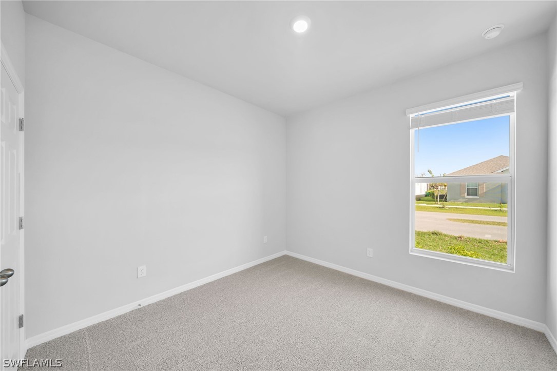 900 Friendship Circle LaBelle, FL 33935 - Photo 16 of 21 an empty room with window