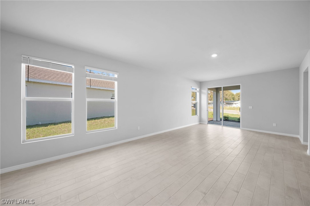 900 Friendship Circle LaBelle, FL 33935 - Photo 4 of 21 an empty room with windows and cabinet