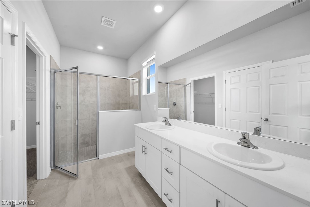 900 Friendship Circle LaBelle, FL 33935 - Photo 9 of 21 a bathroom with a double vanity sink mirror and double