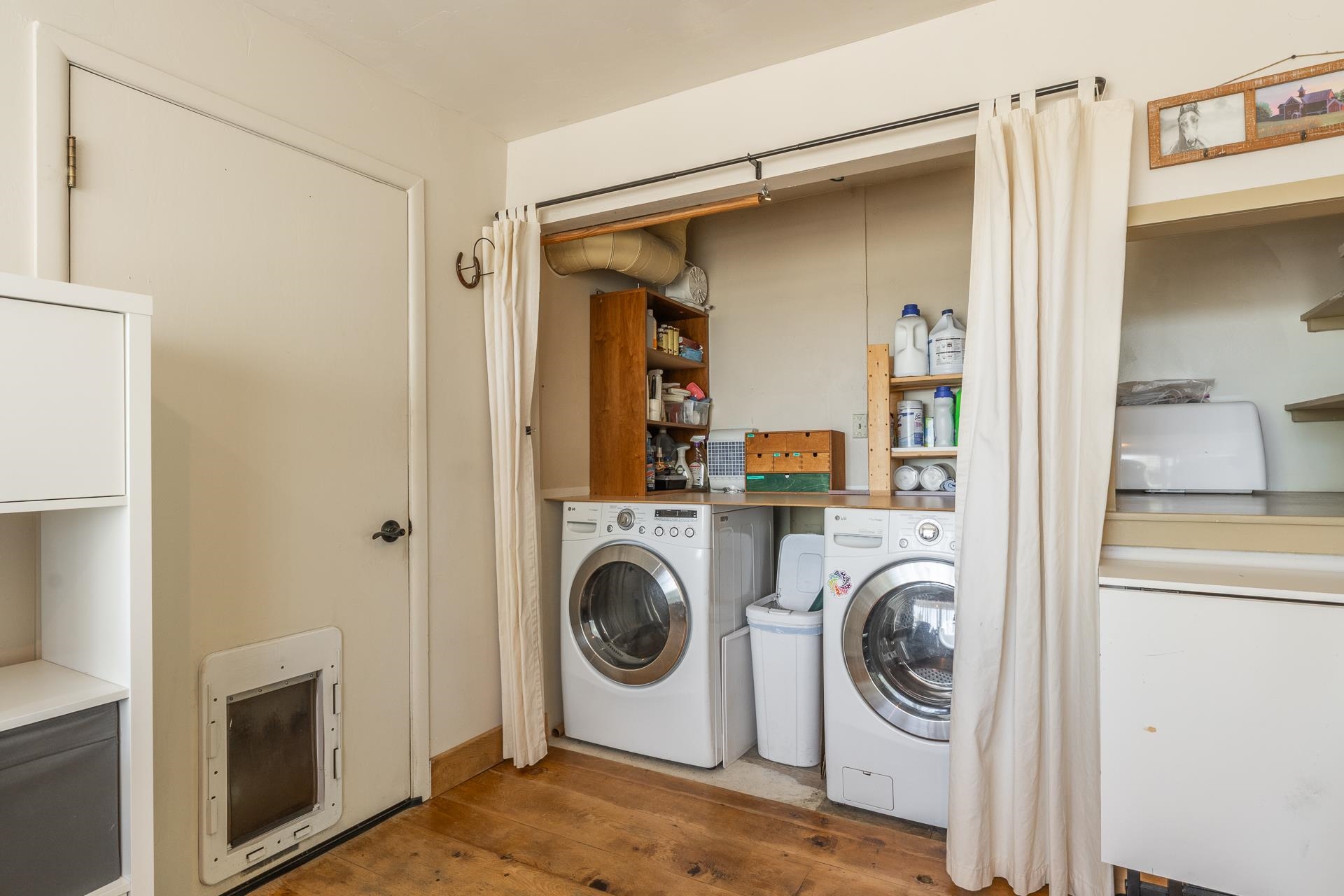 537 Aspen Spring Ranch Road Mammoth Lakes, CA 93546 - Photo 24 of 40 Dedicated laundry area featuring a wood-finish countertop, integrated shelving, and a built-in pet door