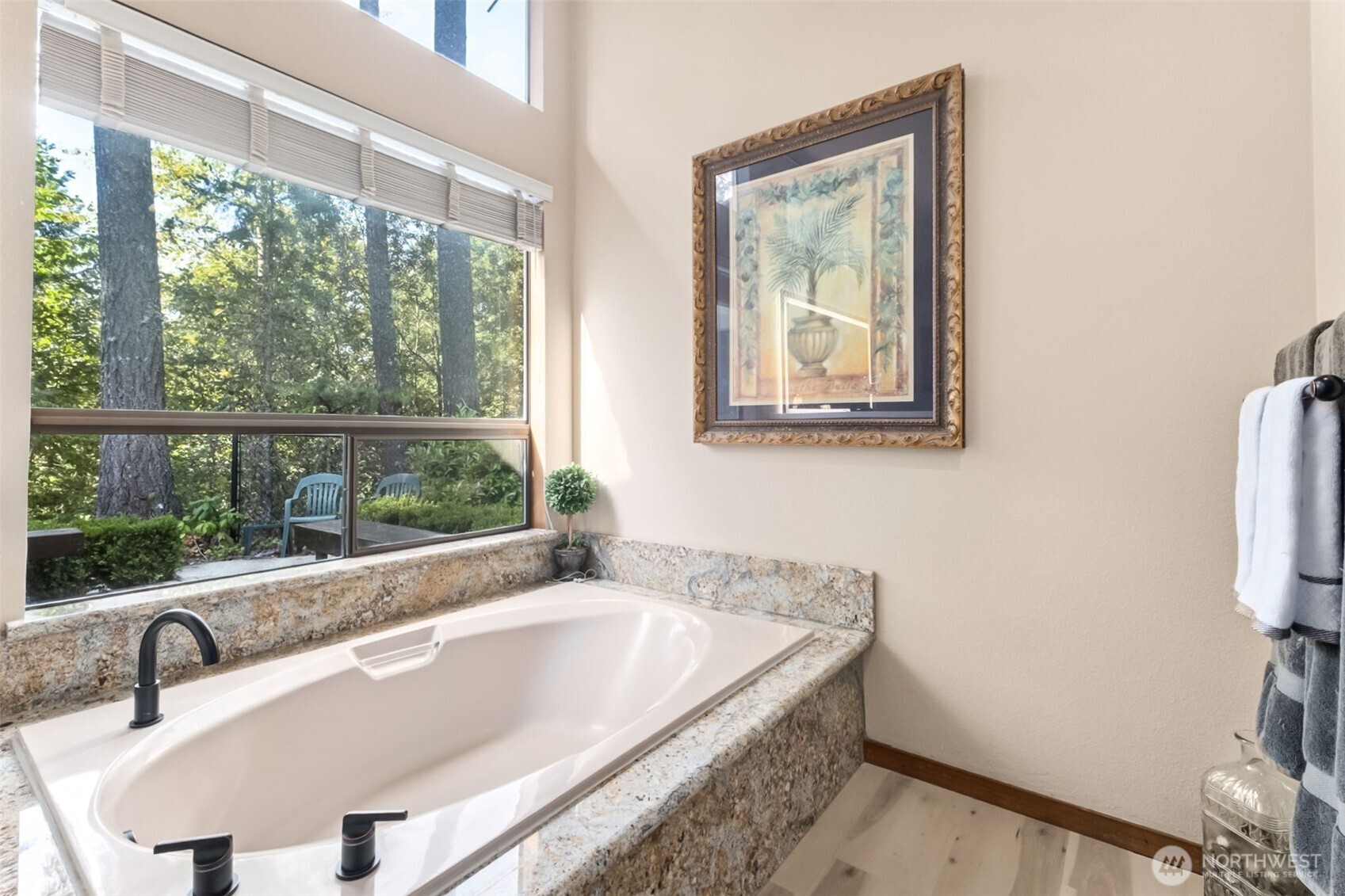 22505 241st Avenue Southeast Maple Valley, WA 98038 - Photo 22 of 30 a bathroom with a tub and a sink