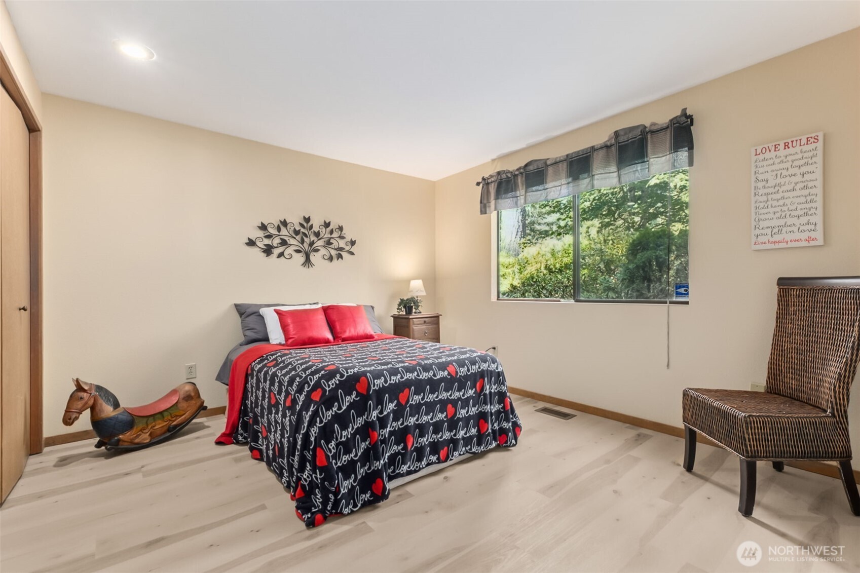 22505 241st Avenue Southeast Maple Valley, WA 98038 - Photo 23 of 30 a bedroom with a bed and a chair