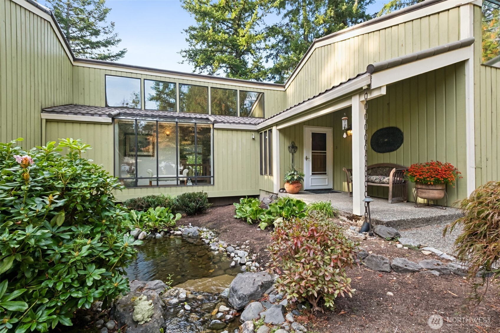 22505 241st Avenue Southeast Maple Valley, WA 98038 - Photo 3 of 30 a front view of a house with garden