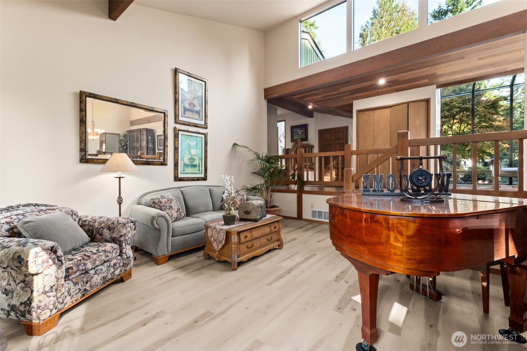 22505 241st Avenue Southeast Maple Valley, WA 98038 - Photo 7 of 30 a living room with furniture and a chandelier