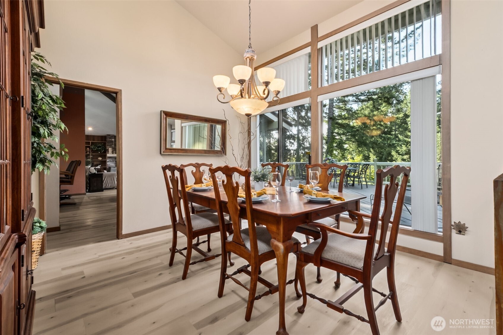 22505 241st Avenue Southeast Maple Valley, WA 98038 - Photo 8 of 30 a view of a dining room with furniture window and wooden floor