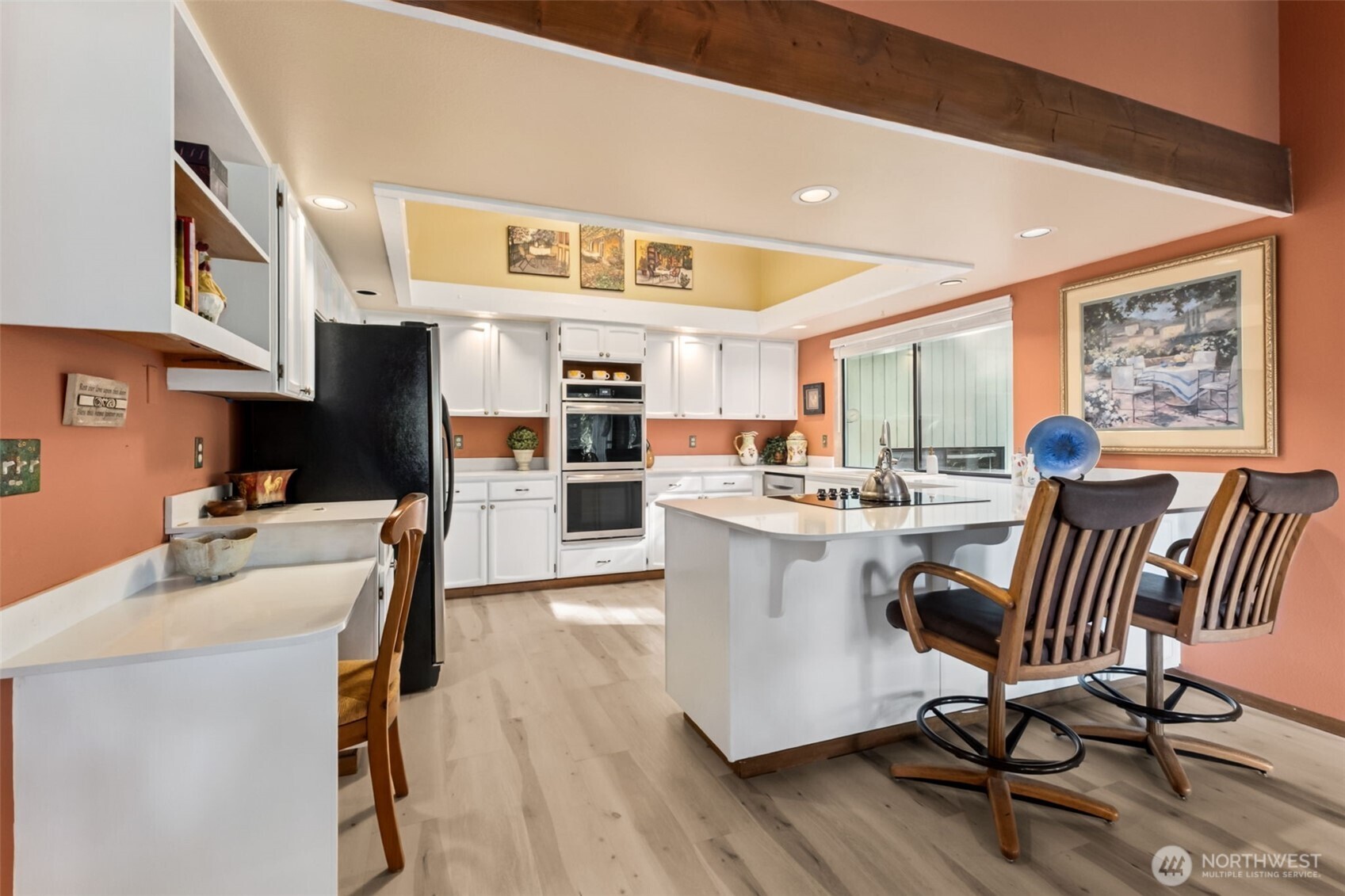 22505 241st Avenue Southeast Maple Valley, WA 98038 - Photo 10 of 30 a living room with stainless steel appliances kitchen island granite countertop furniture and a kitchen view