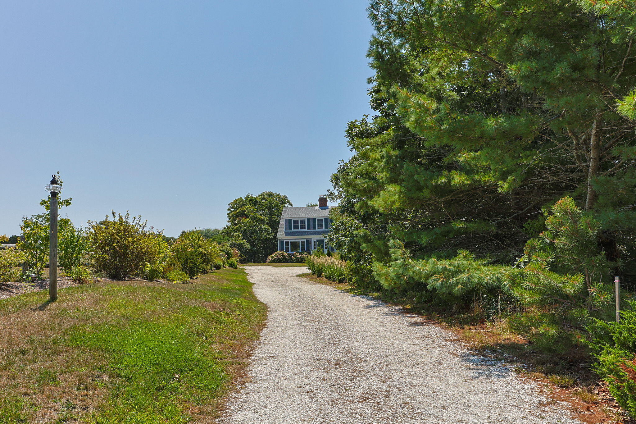 58 Stepping Stones Road Chatham, MA 02633 - Photo 2 of 52 a view of a pathway with a garden