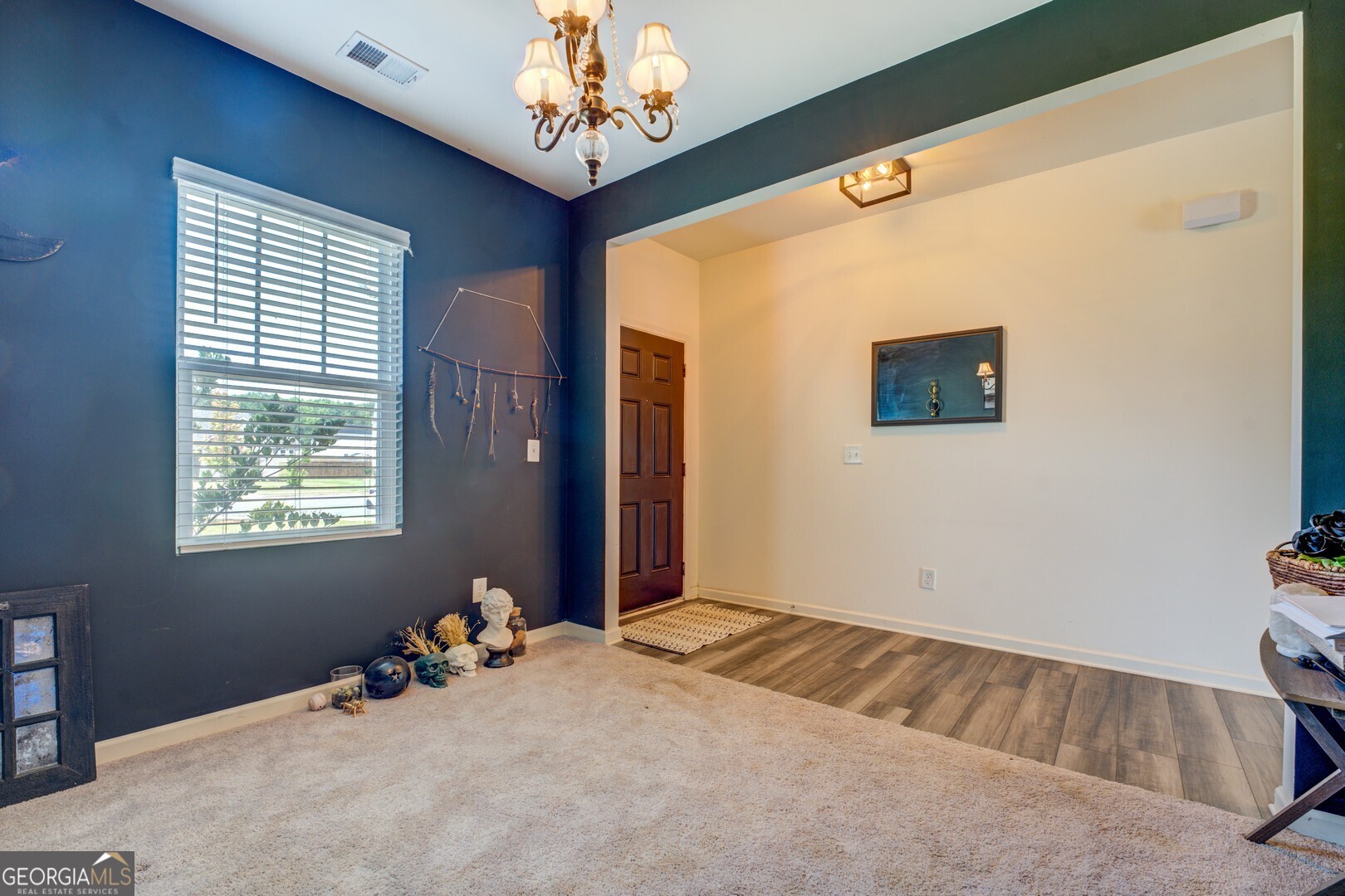 89 Dorsey Way Monroe, GA 30655 - Photo 14 of 26 a view of a livingroom with a chandelier