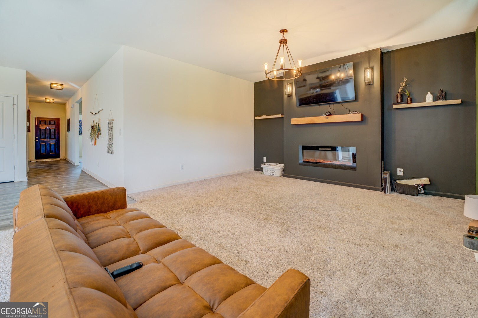 89 Dorsey Way Monroe, GA 30655 - Photo 17 of 26 a bedroom with furniture and a couch