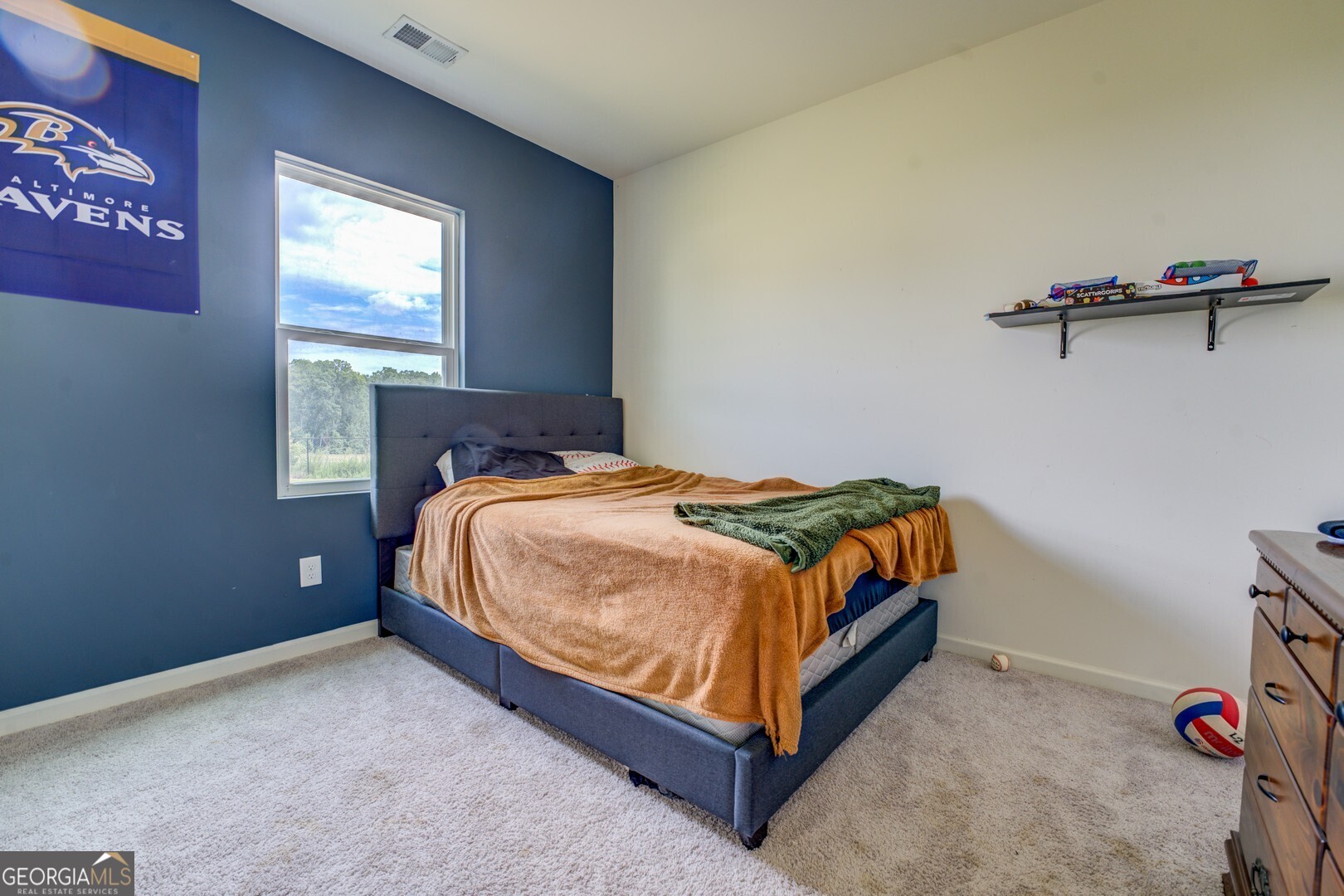 89 Dorsey Way Monroe, GA 30655 - Photo 20 of 26 a bedroom with a bed and a window