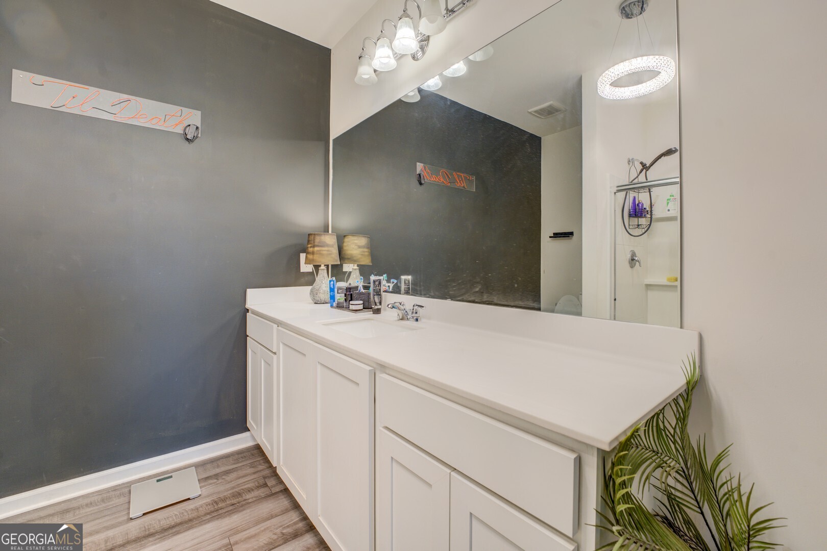 89 Dorsey Way Monroe, GA 30655 - Photo 23 of 26 a bathroom with a sink a vanity and a mirror