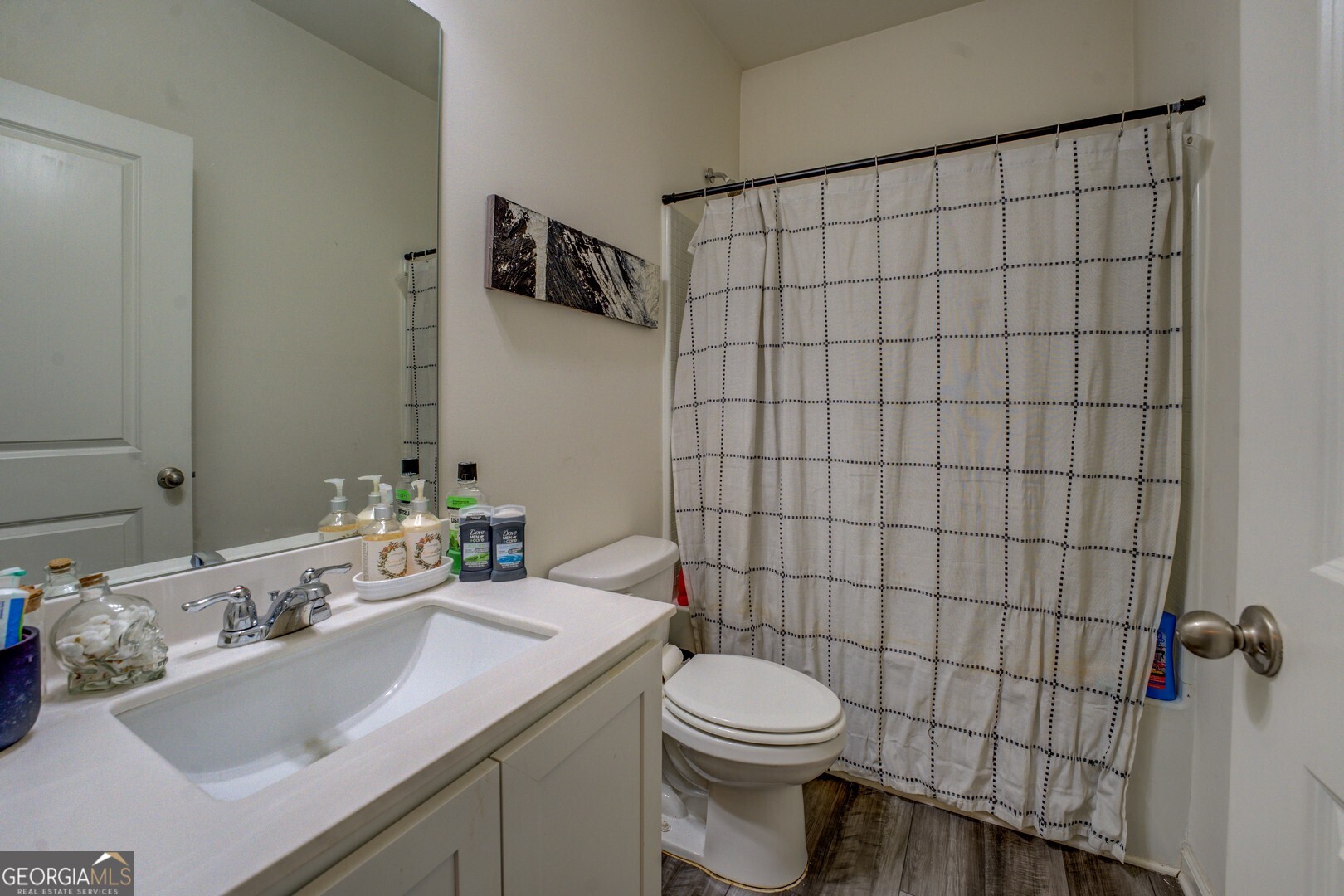 89 Dorsey Way Monroe, GA 30655 - Photo 24 of 26 a bathroom with a sink a toilet and shower