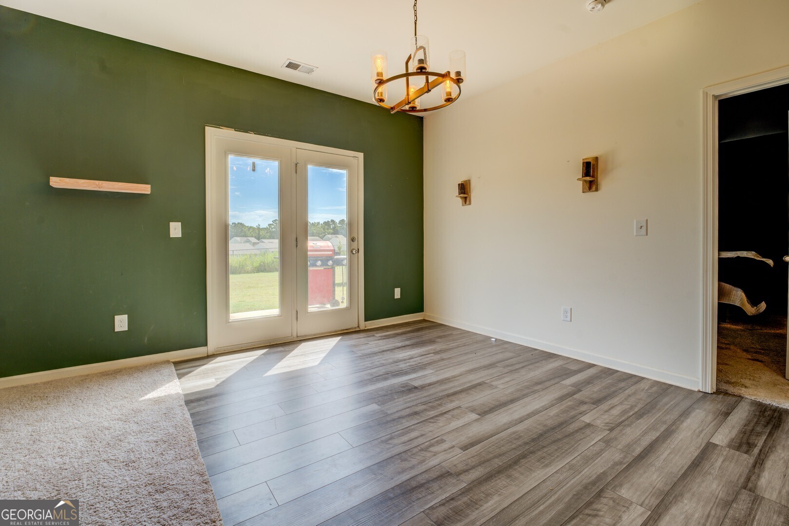 89 Dorsey Way Monroe, GA 30655 - Photo 26 of 26 a view of a livingroom with wooden floor and windows