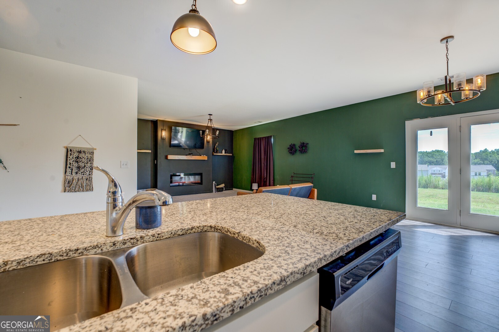 89 Dorsey Way Monroe, GA 30655 - Photo 5 of 26 a kitchen with kitchen island a sink appliances and a counter top space