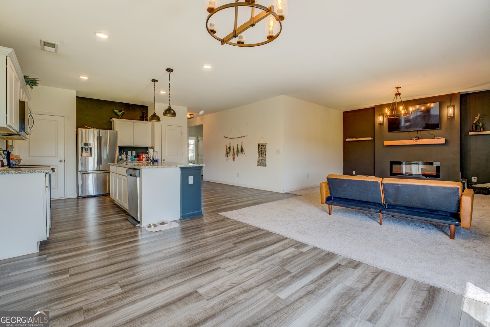 89 Dorsey Way Monroe, GA 30655 - Photo 9 of 26 a living room with furniture and a kitchen view