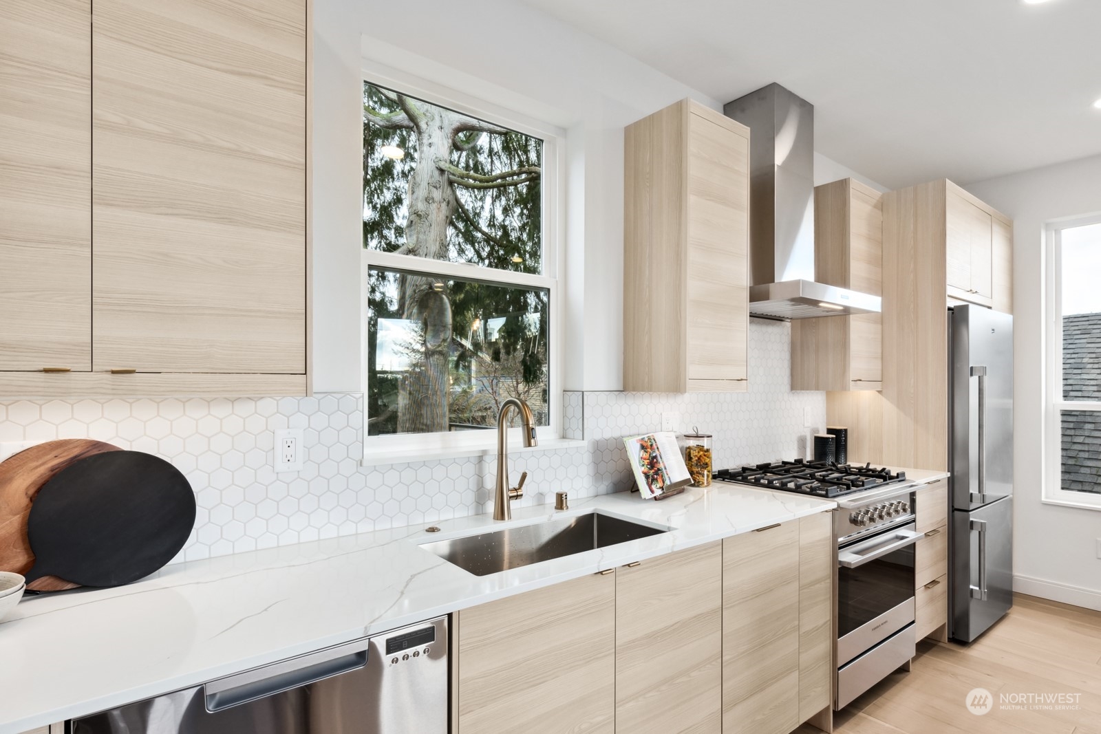 356 North 75th Street, Unit B Seattle, WA 98103 - Photo 11 of 32 a kitchen with a sink a stove and a microwave