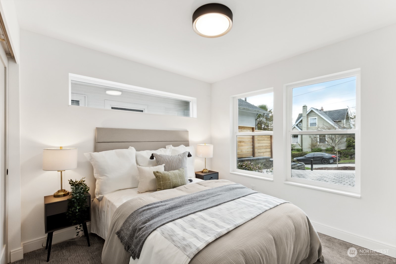 356 North 75th Street, Unit B Seattle, WA 98103 - Photo 13 of 32 a bedroom with a bed and window