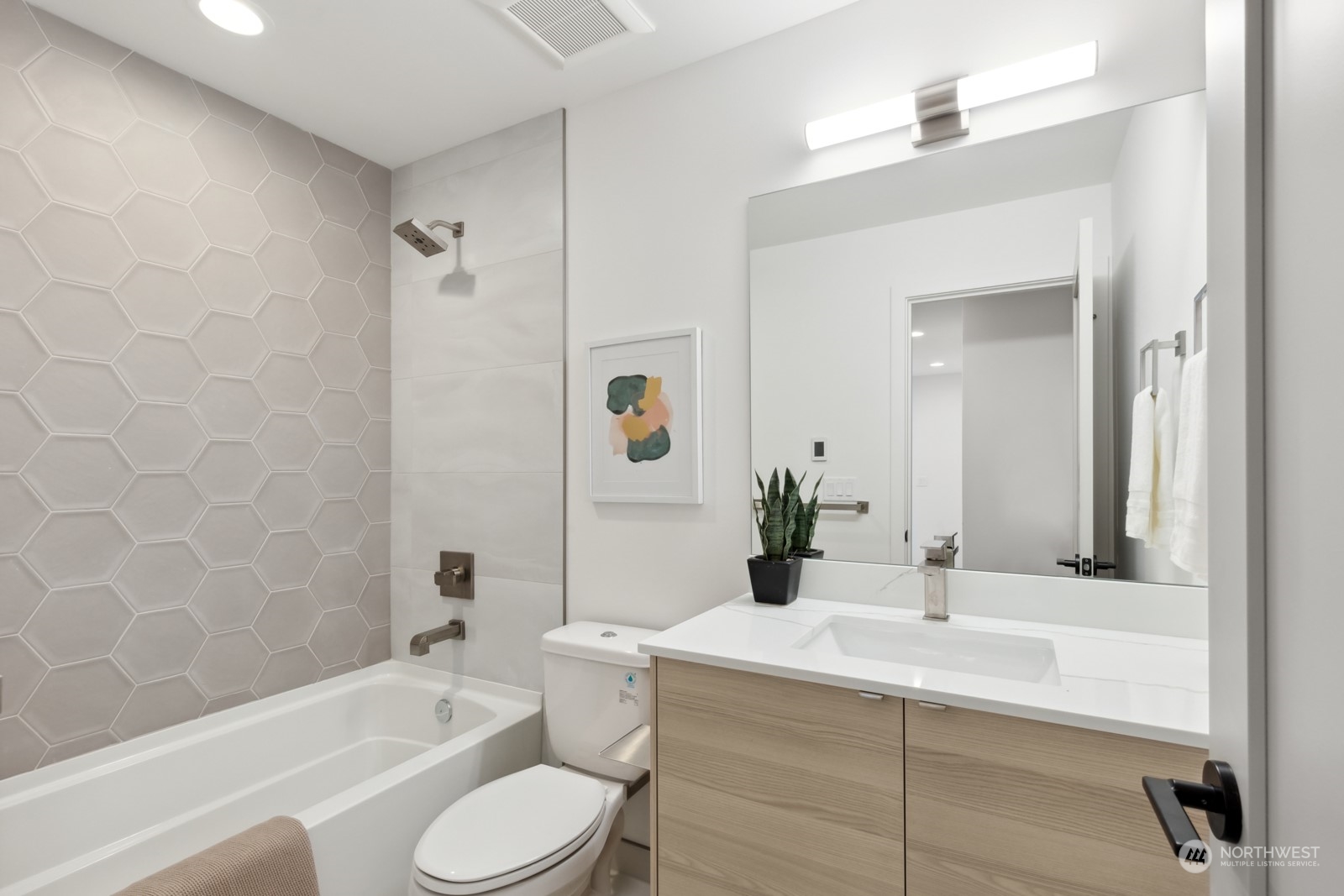 356 North 75th Street, Unit B Seattle, WA 98103 - Photo 14 of 32 a bathroom with a sink toilet bathtub and shower