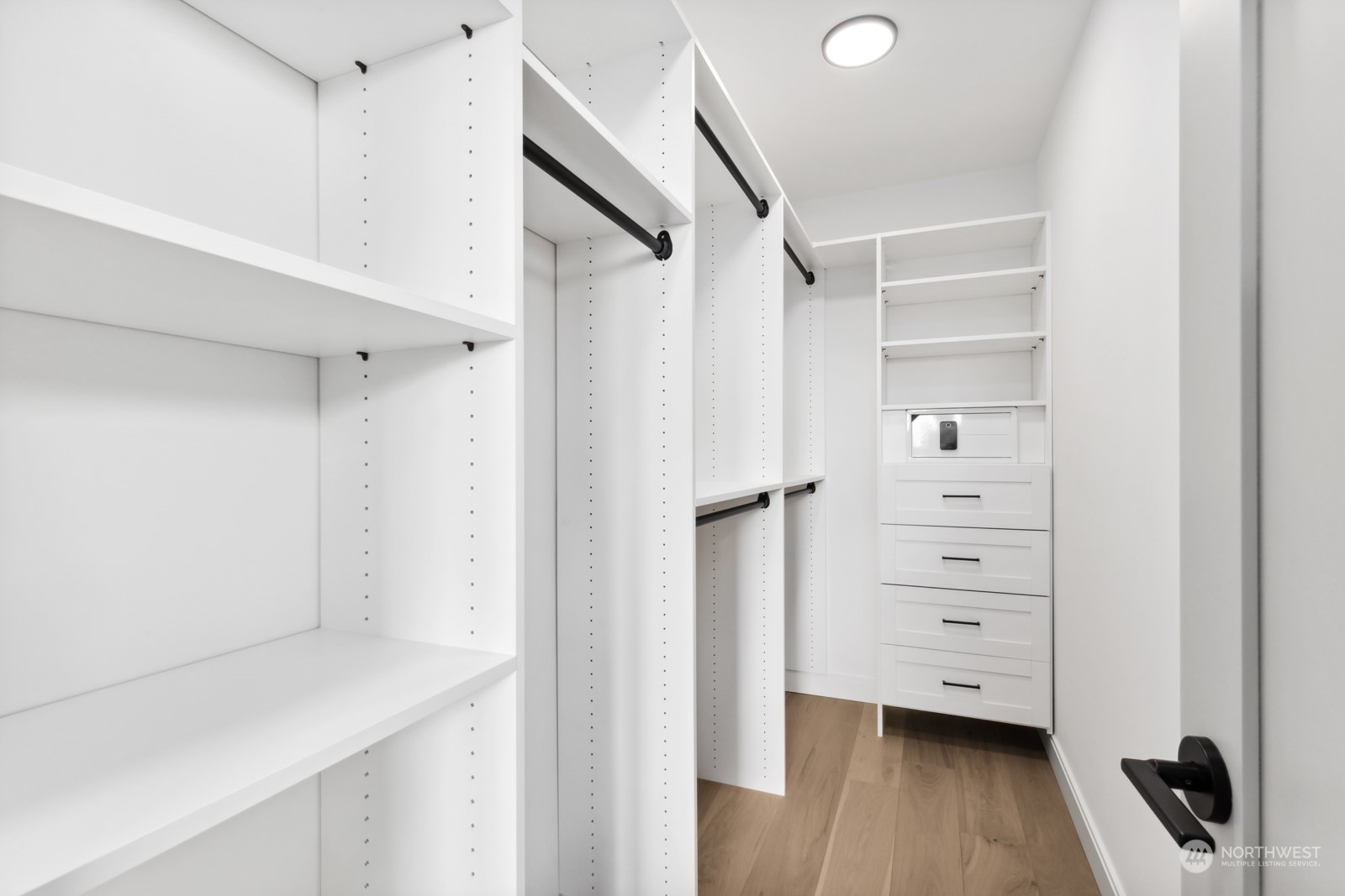 356 North 75th Street, Unit B Seattle, WA 98103 - Photo 16 of 32 a view of walk in closet with empty racks