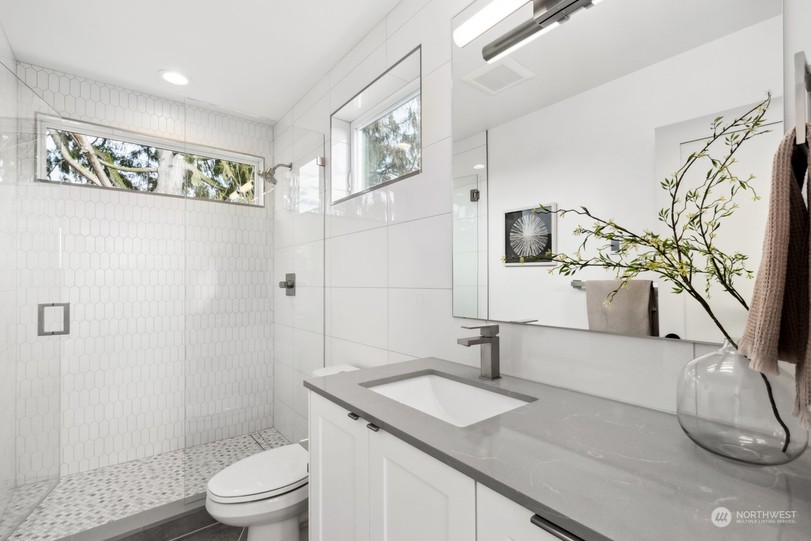 356 North 75th Street, Unit B Seattle, WA 98103 - Photo 17 of 32 a bathroom with a sink a toilet and shower