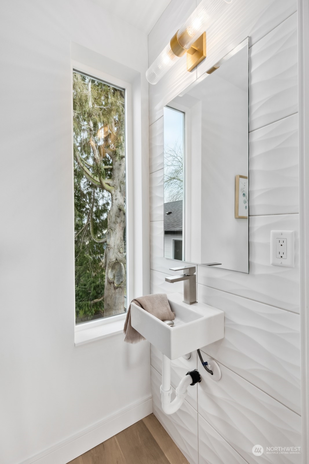 356 North 75th Street, Unit B Seattle, WA 98103 - Photo 18 of 32 a bathroom with a sink and a mirror