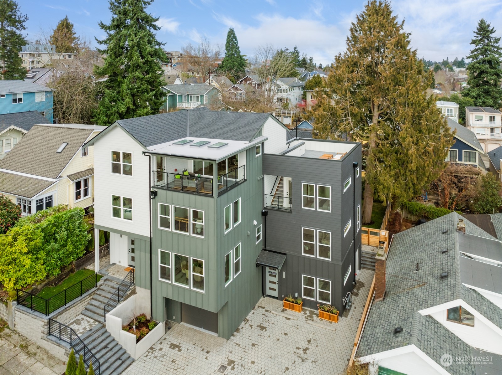356 North 75th Street, Unit B Seattle, WA 98103 - Photo 26 of 32 a front view of a residential apartment building with a yard