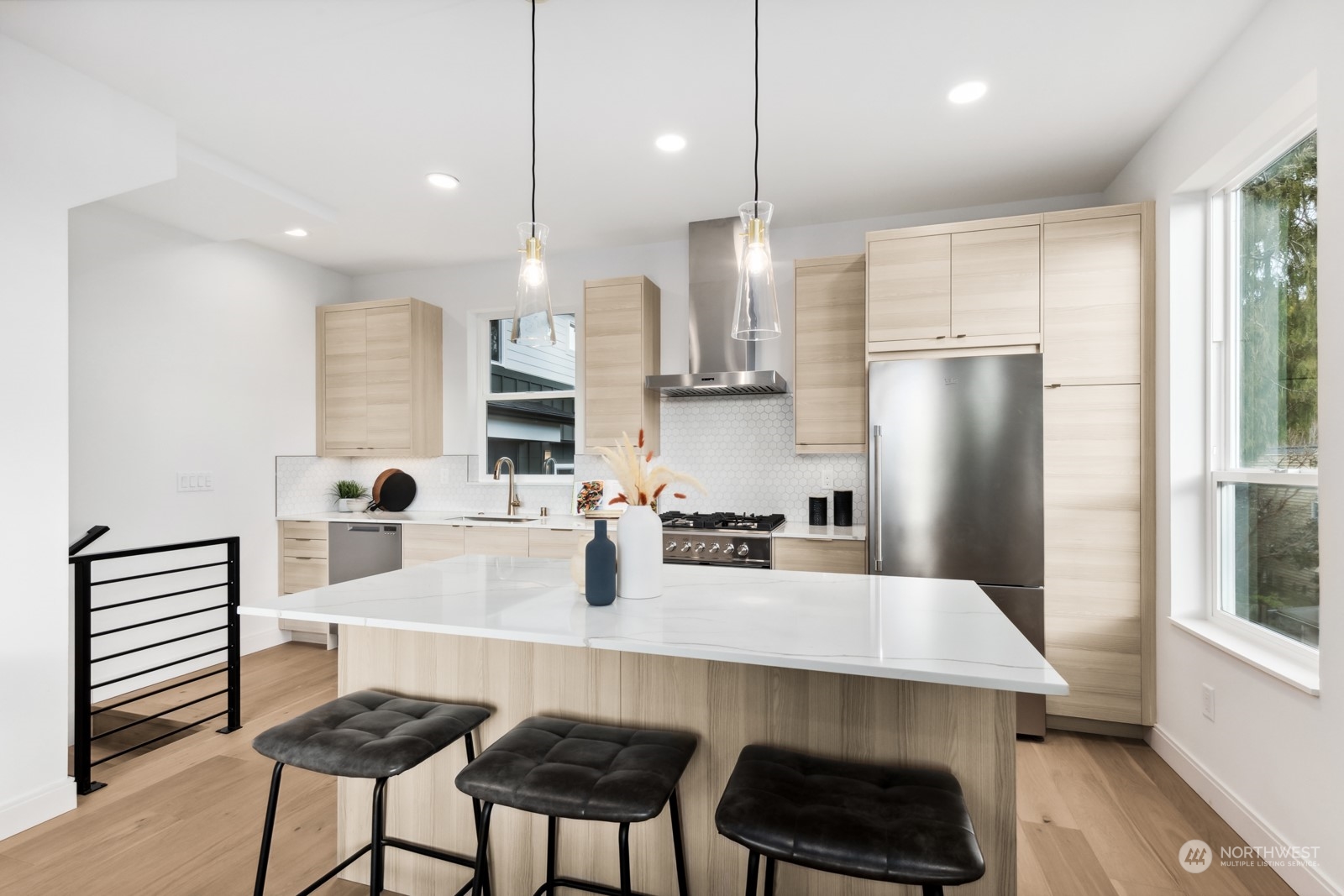356 North 75th Street, Unit B Seattle, WA 98103 - Photo 5 of 32 a kitchen with refrigerator and chairs