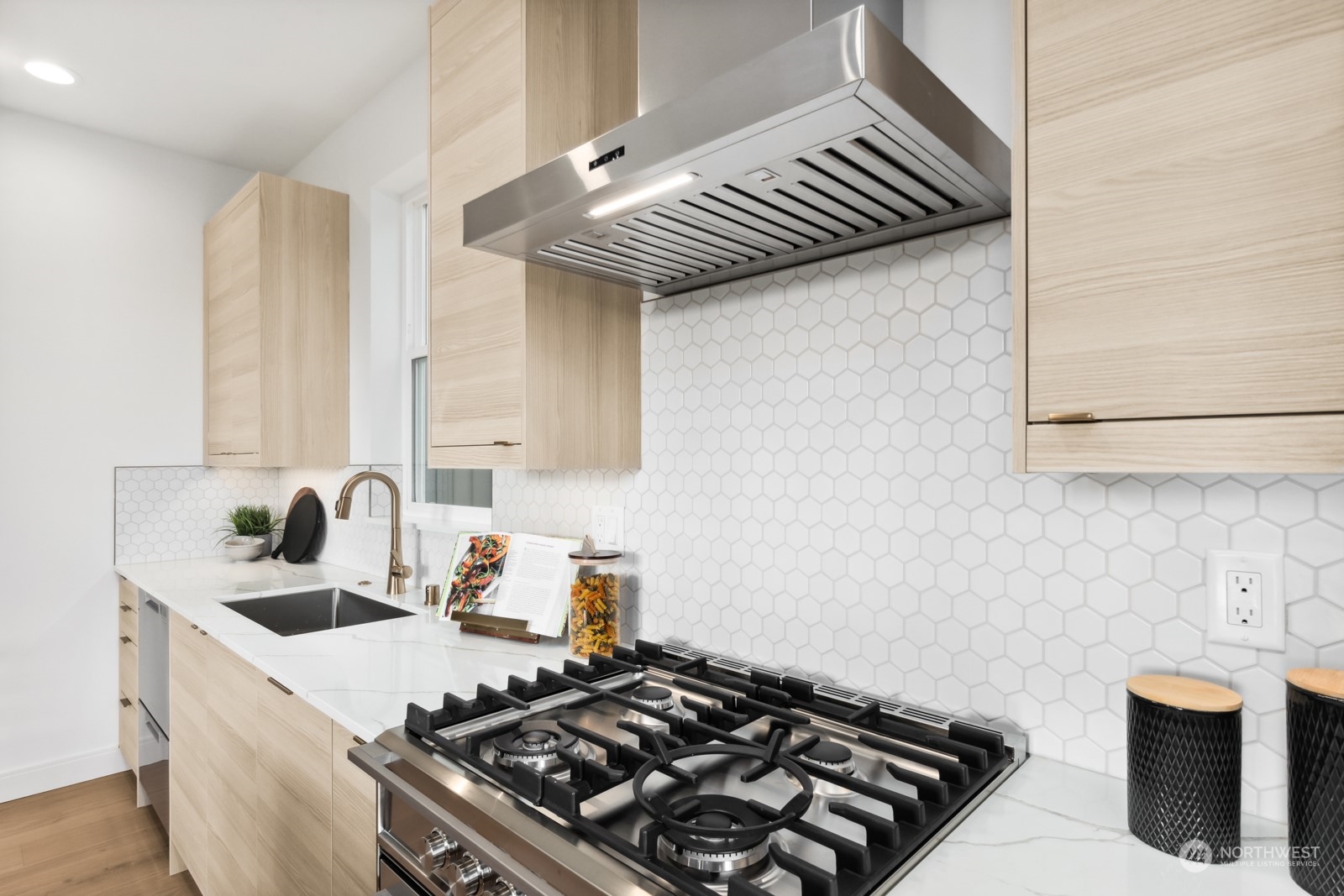 356 North 75th Street, Unit B Seattle, WA 98103 - Photo 8 of 32 a kitchen with a stove and a sink