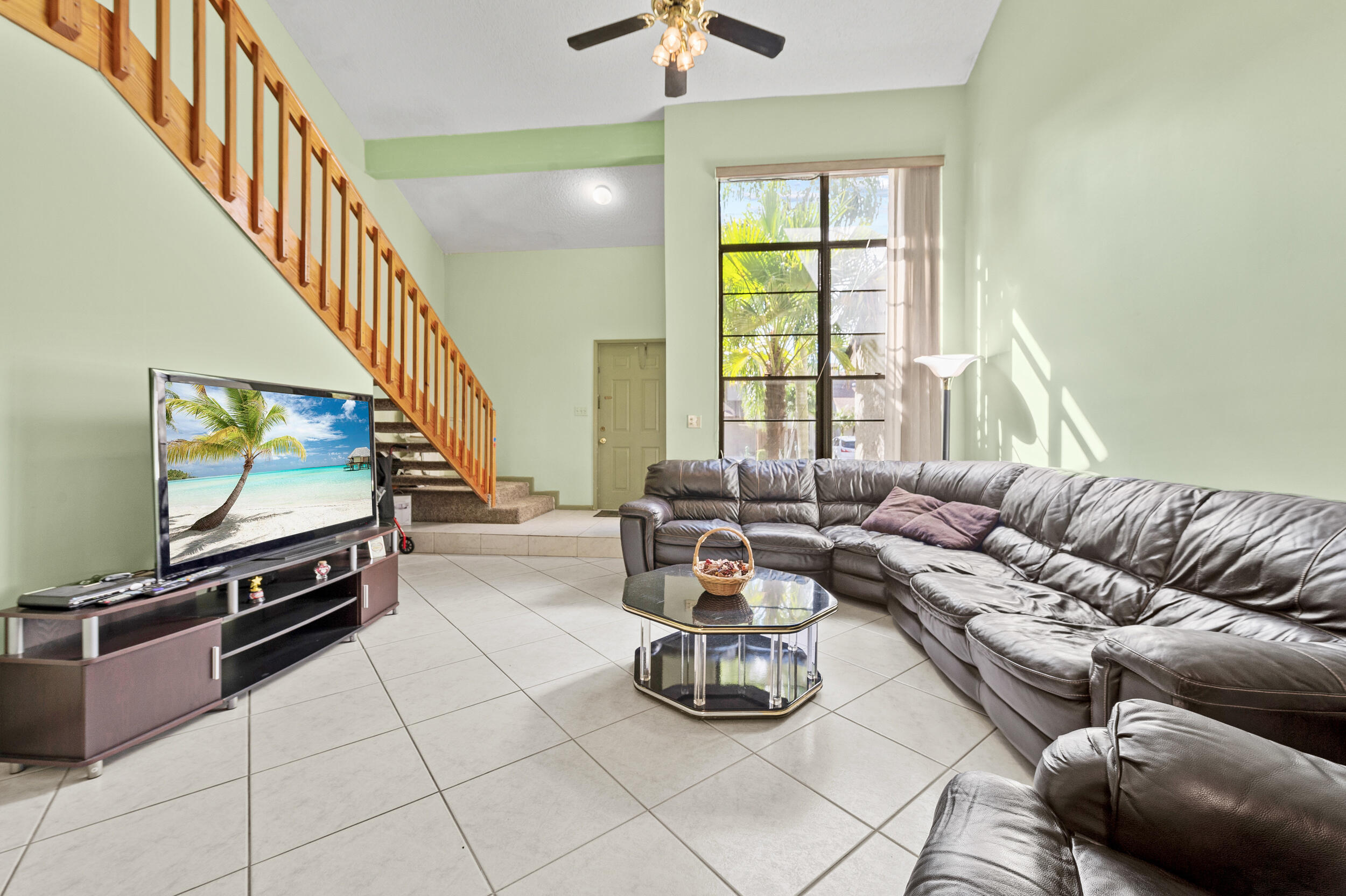 22384 Thousand Pines Lane Boca Raton, FL 33428 - Photo 15 of 45 a living room with furniture and a flat screen tv