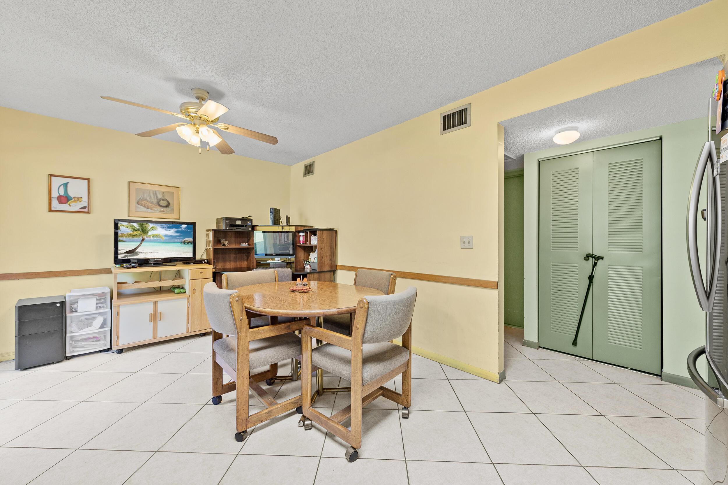 22384 Thousand Pines Lane Boca Raton, FL 33428 - Photo 23 of 45 a dining room with furniture and a kitchen
