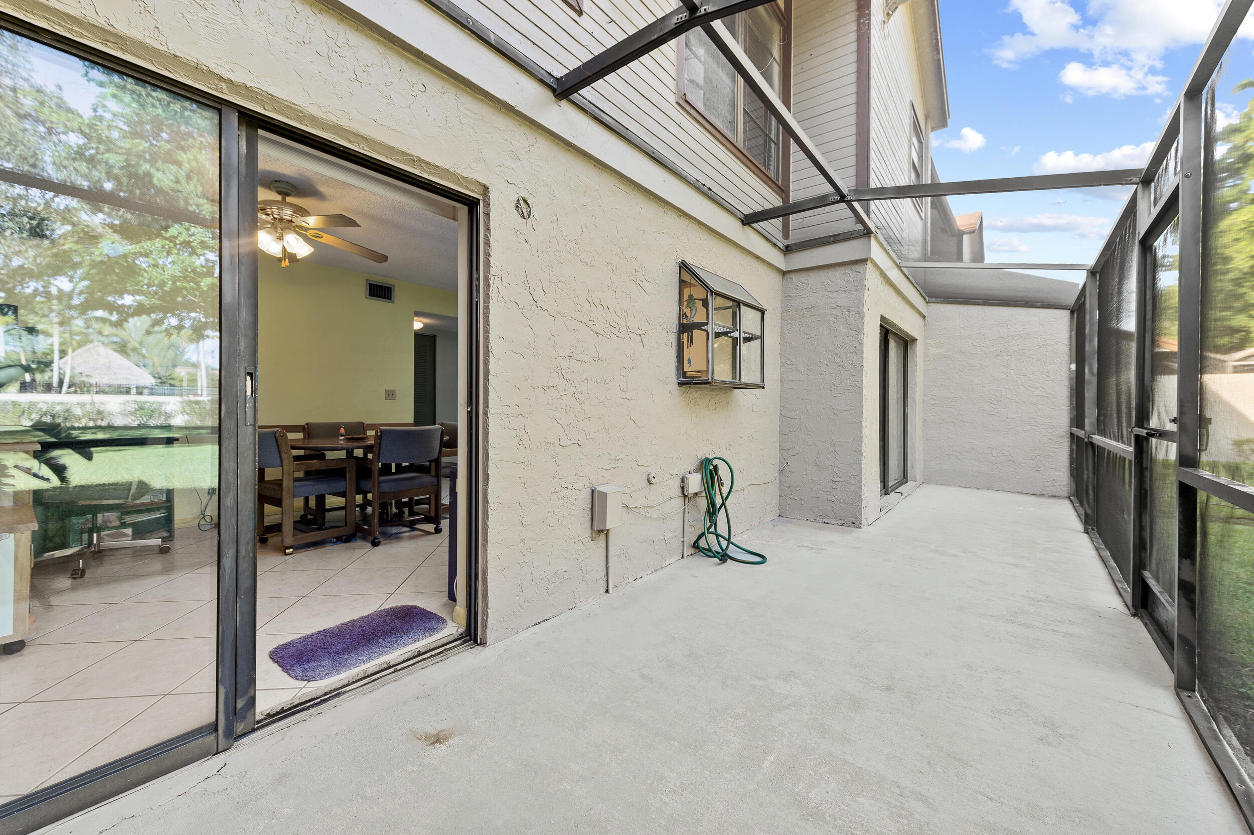 22384 Thousand Pines Lane Boca Raton, FL 33428 - Photo 26 of 45 a view of a livingroom with a furniture and floor to ceiling window