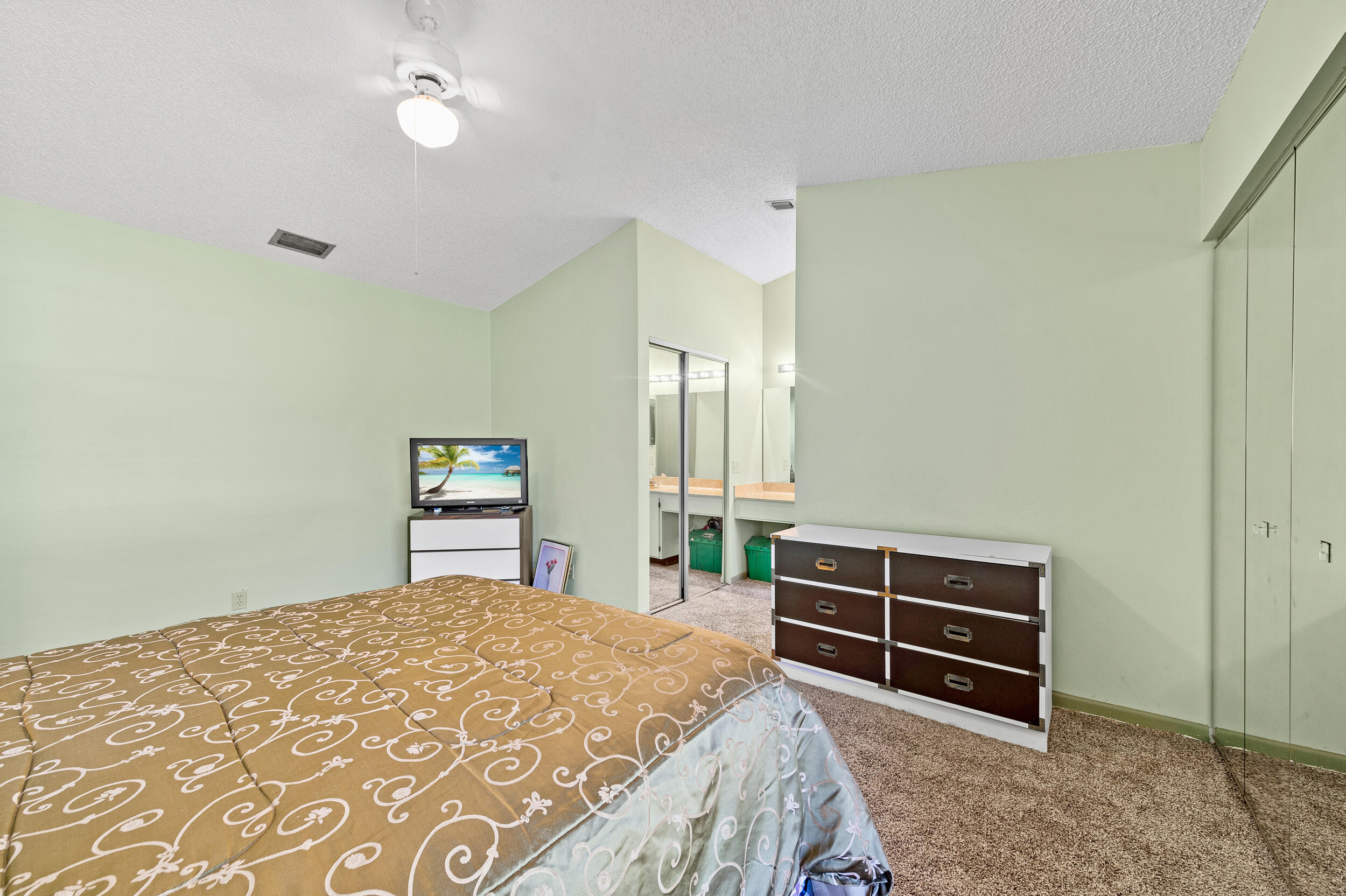 22384 Thousand Pines Lane Boca Raton, FL 33428 - Photo 34 of 45 a bedroom with a bed and a closet