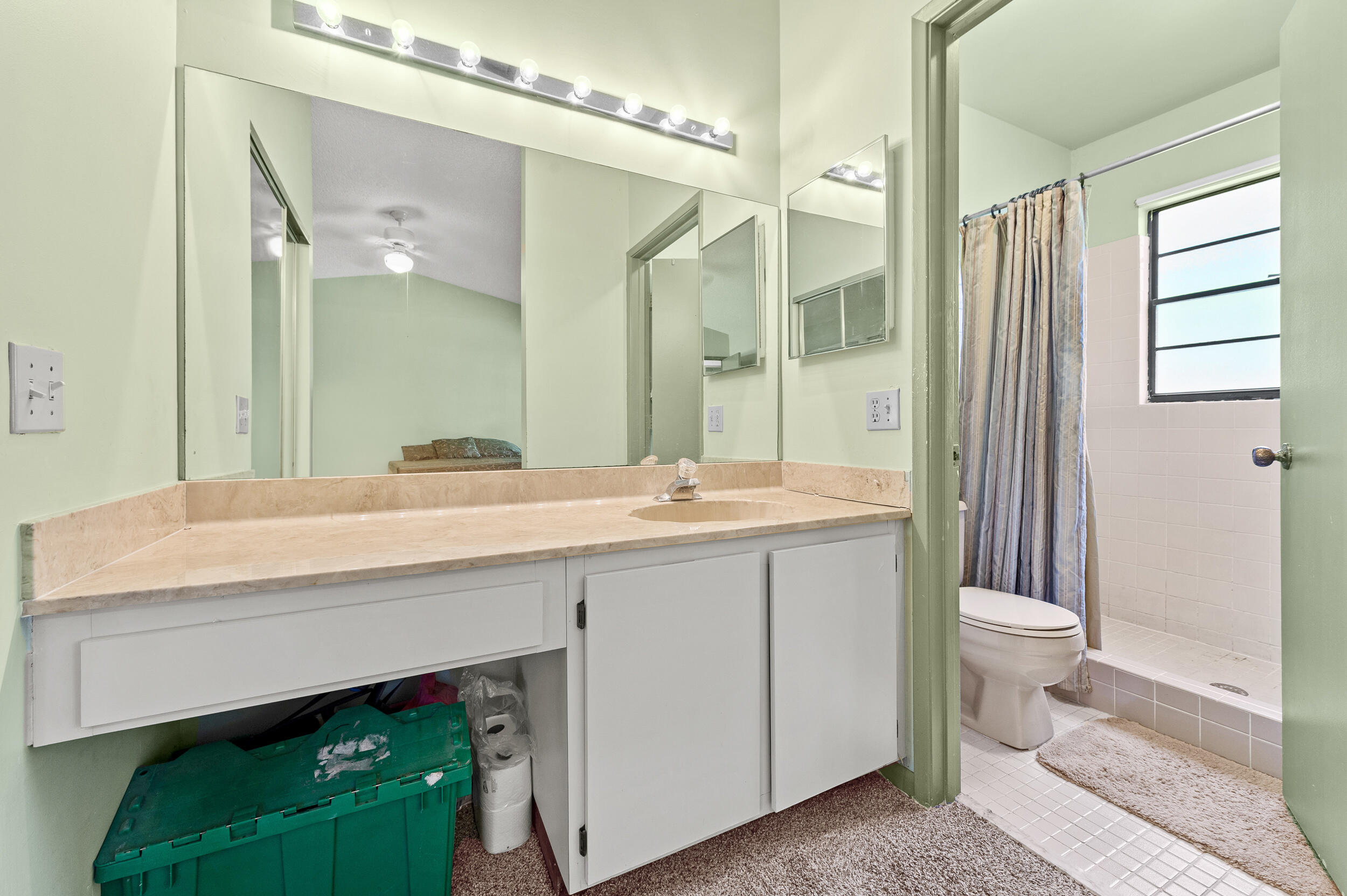 22384 Thousand Pines Lane Boca Raton, FL 33428 - Photo 35 of 45 a bathroom with a double vanity sink toilet and a mirror