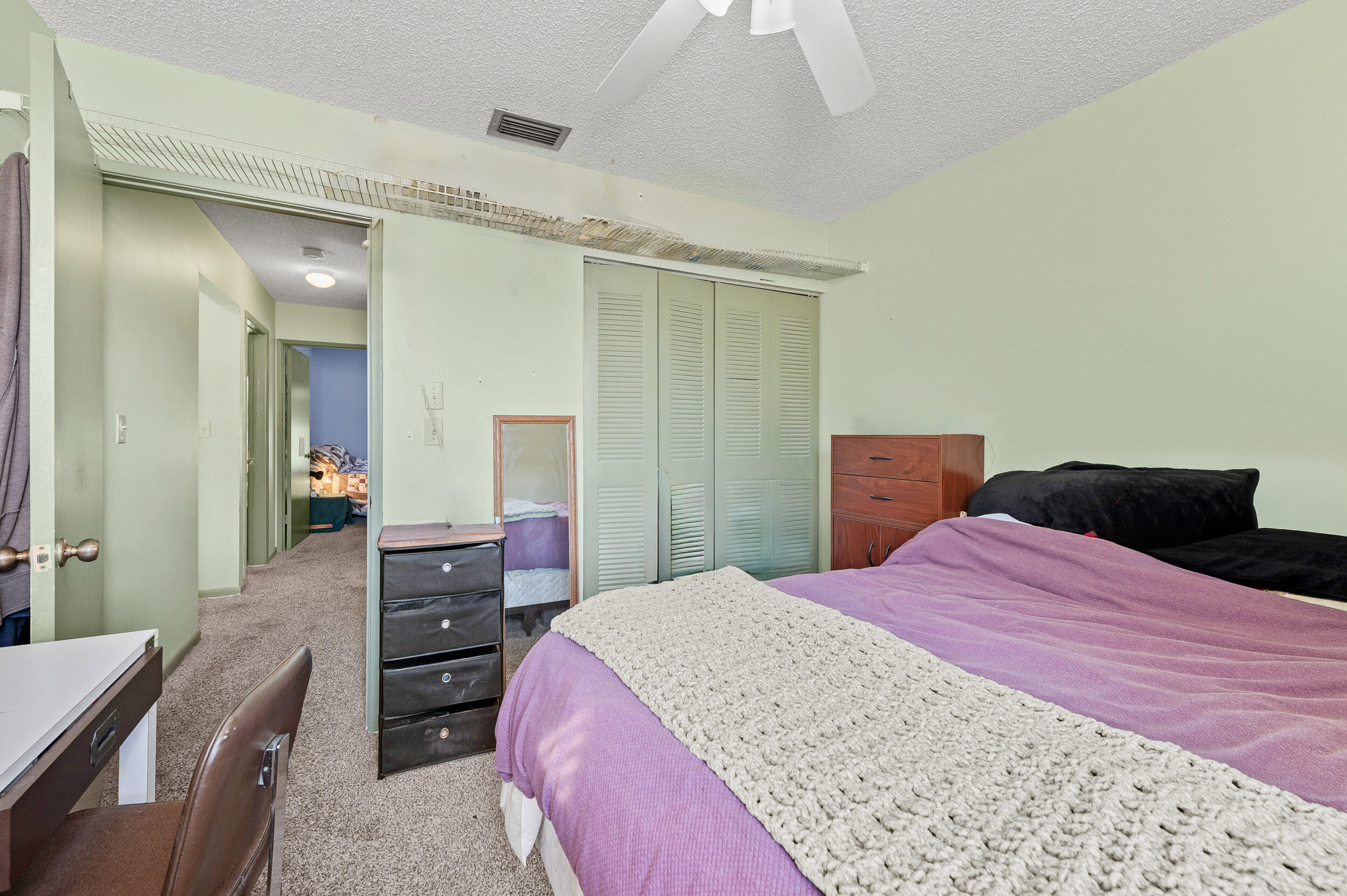 22384 Thousand Pines Lane Boca Raton, FL 33428 - Photo 38 of 45 a bedroom with a bed and dresser