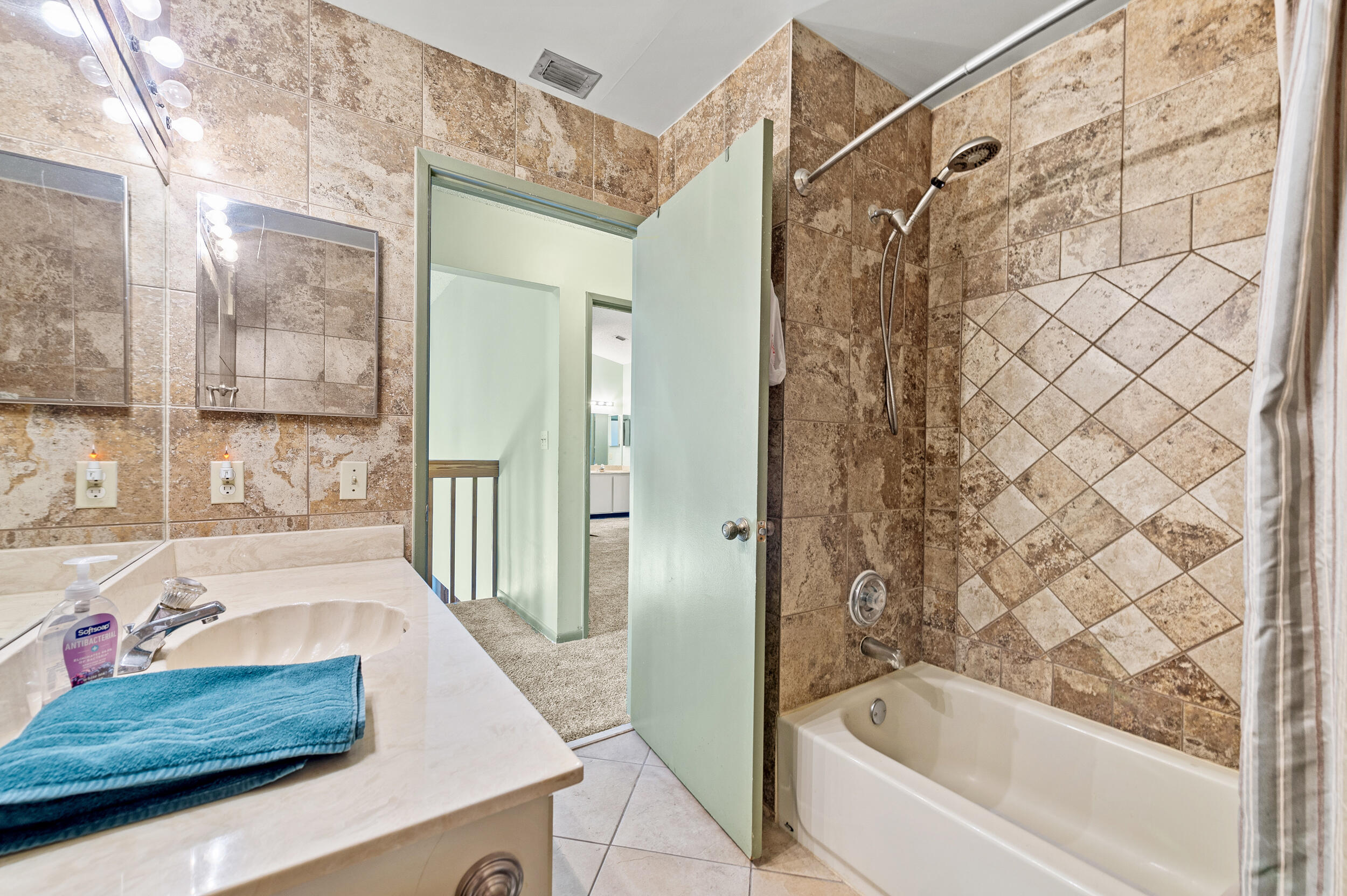 22384 Thousand Pines Lane Boca Raton, FL 33428 - Photo 42 of 45 a bathroom with a granite countertop sink and a bathtub