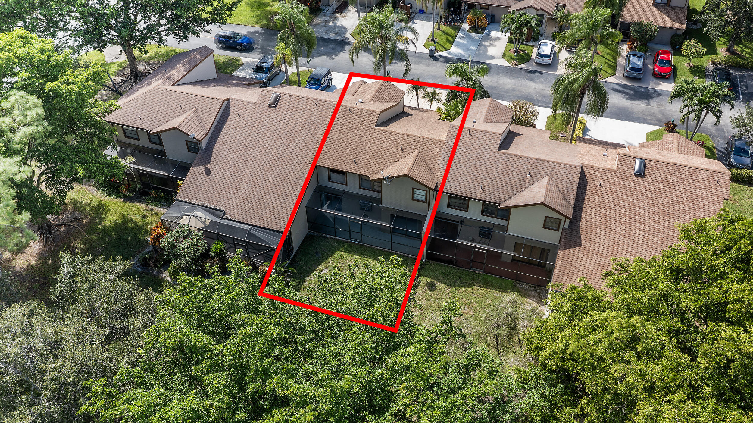 22384 Thousand Pines Lane Boca Raton, FL 33428 - Photo 7 of 45 an aerial view of a house with swimming pool and red umbrella