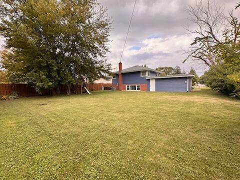 6839 West 127th Street Palos Heights, IL 60463 - Photo 14 of 15 a view of a large pool with an outdoor space and seating area