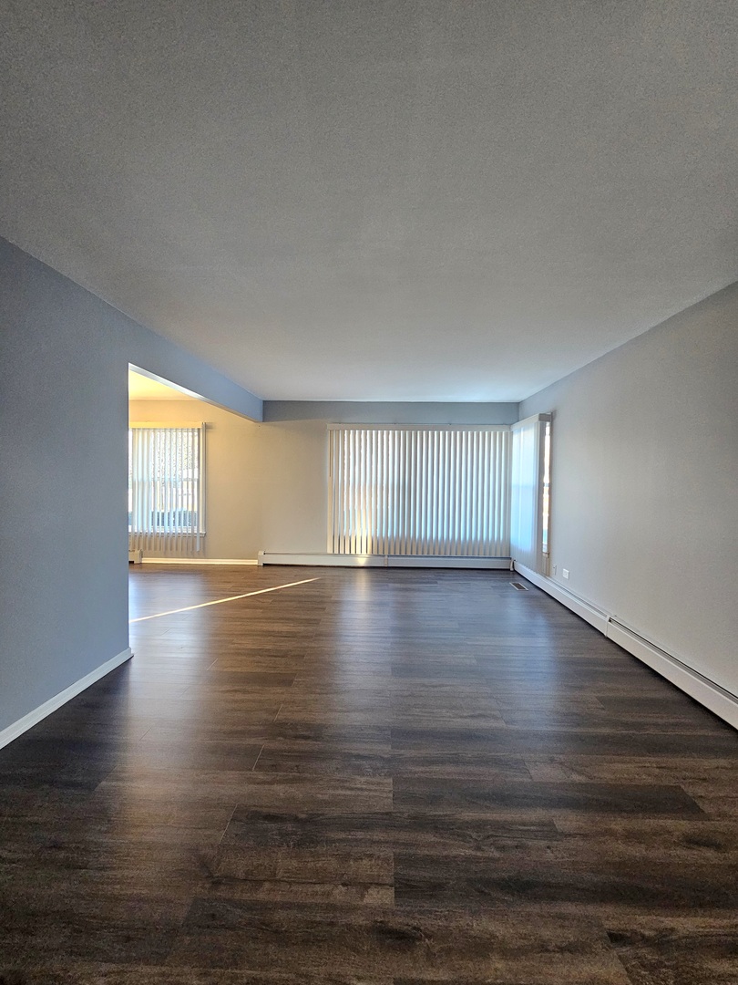 6839 West 127th Street Palos Heights, IL 60463 - Photo 2 of 15 a view of empty room with wooden floor and fan
