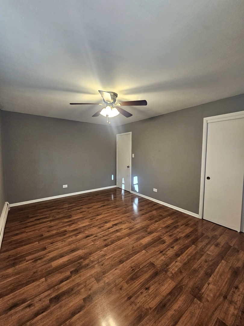 6839 West 127th Street Palos Heights, IL 60463 - Photo 6 of 15 a view of a room with wooden floor