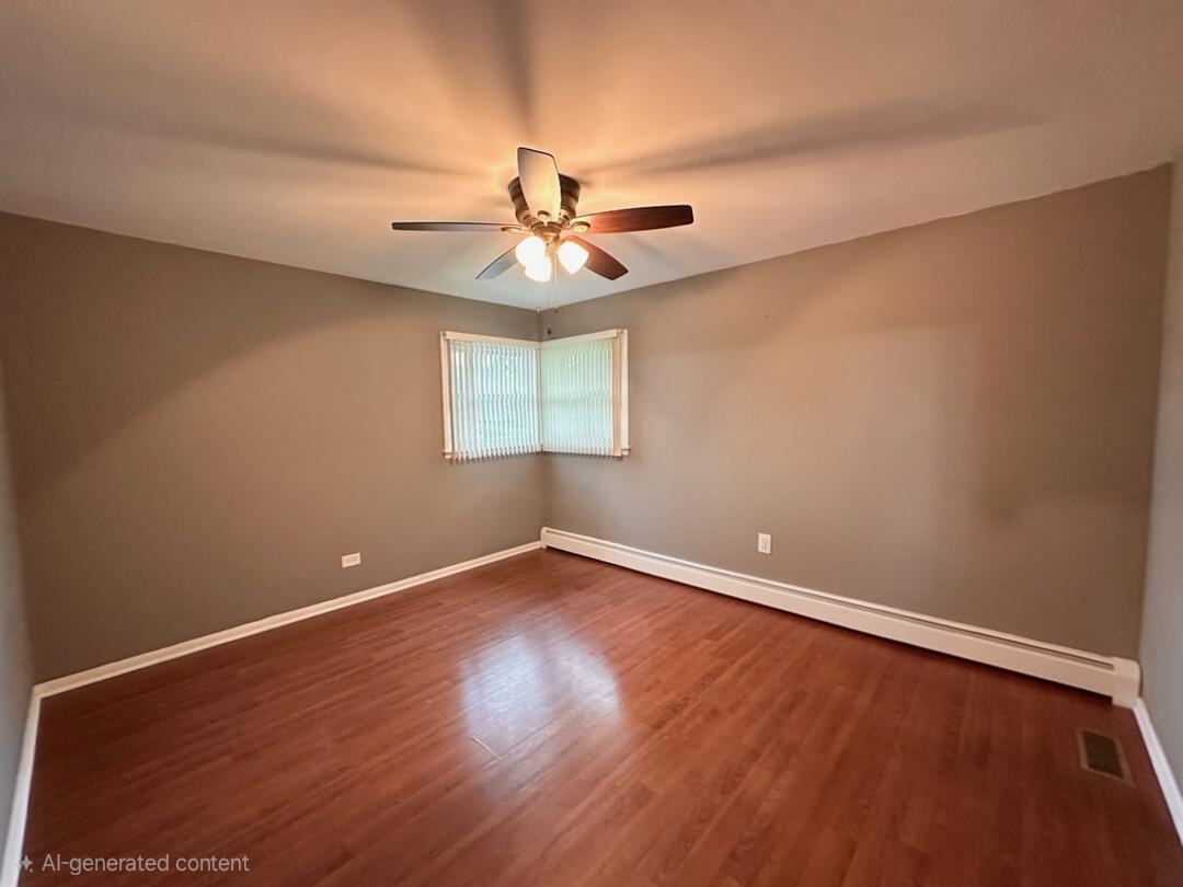 6839 West 127th Street Palos Heights, IL 60463 - Photo 7 of 15 an empty room with wooden floor and windows