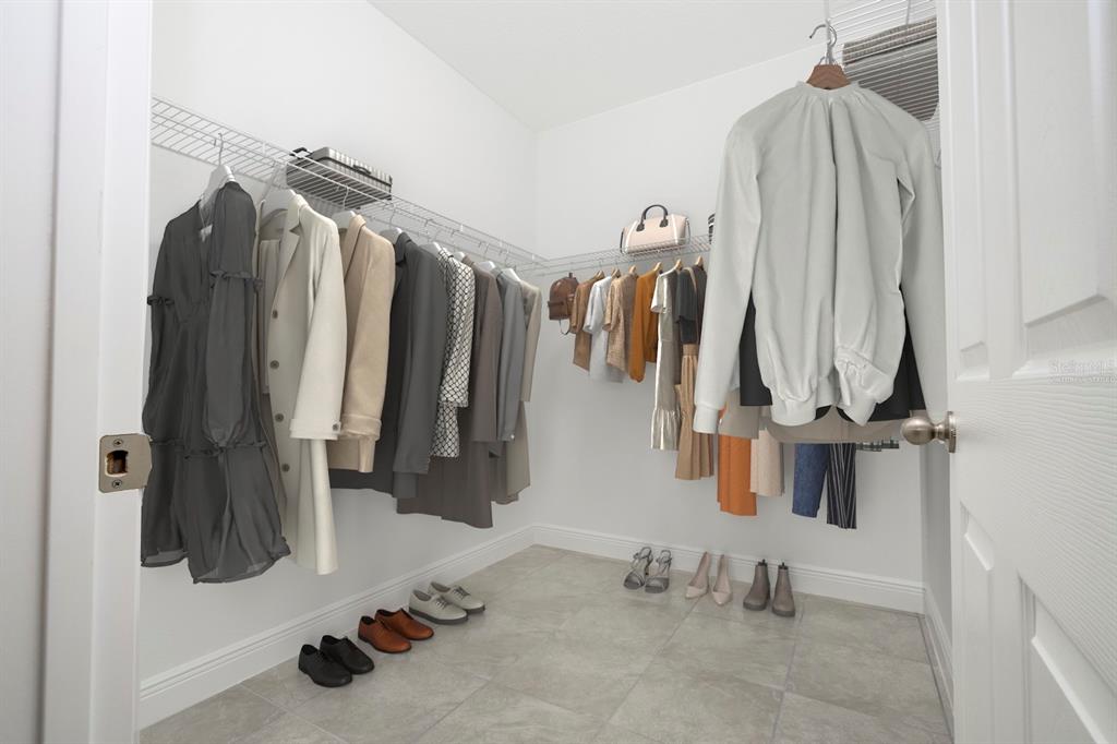 208 Locust Pass Ocala, FL 34472 - Photo 37 of 71 a view of walk in closet with clothes