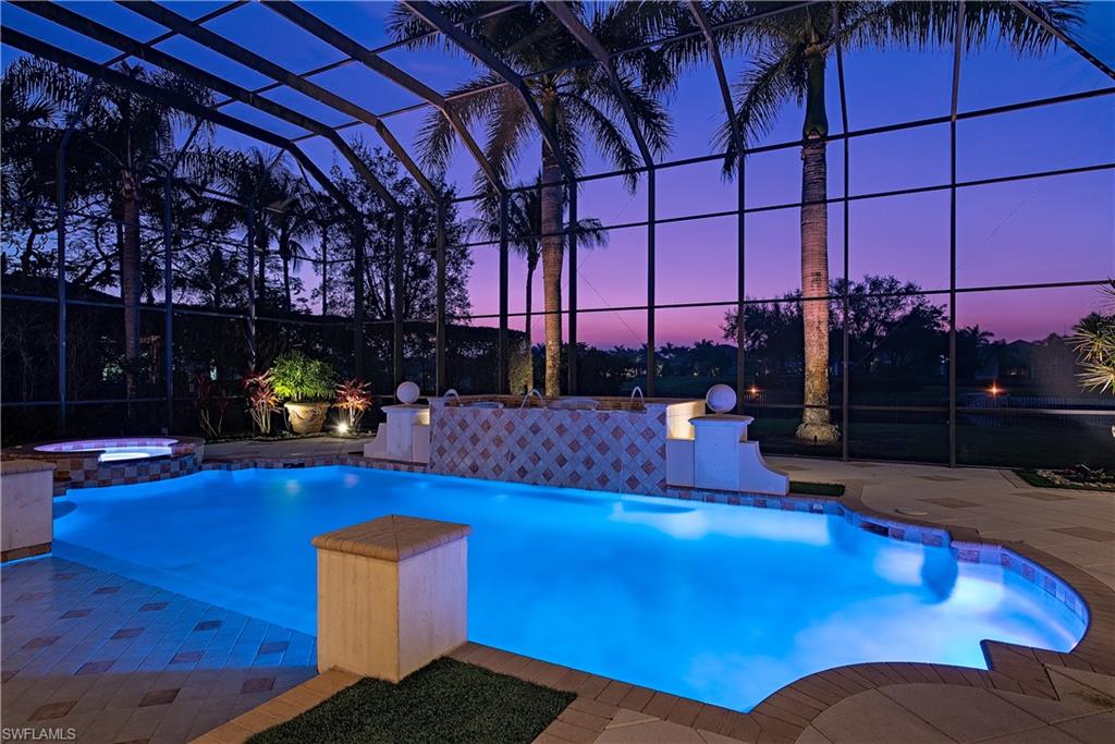 6265 Highcroft Drive Naples, FL 34119 - Photo 2 of 22 a view of a swimming pool with an outdoor seating